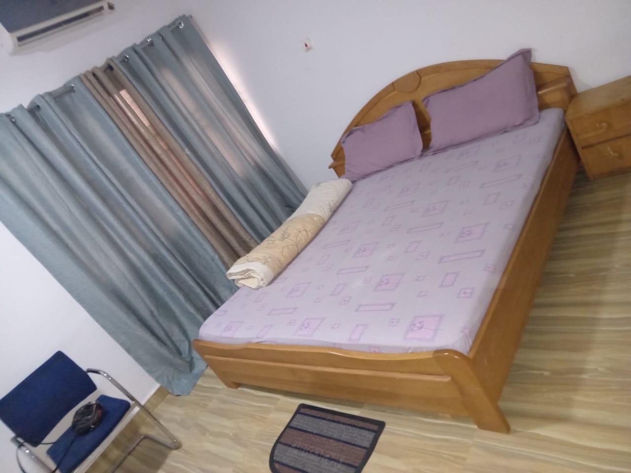 Deluxe hotel room with king bed and balcony style feel